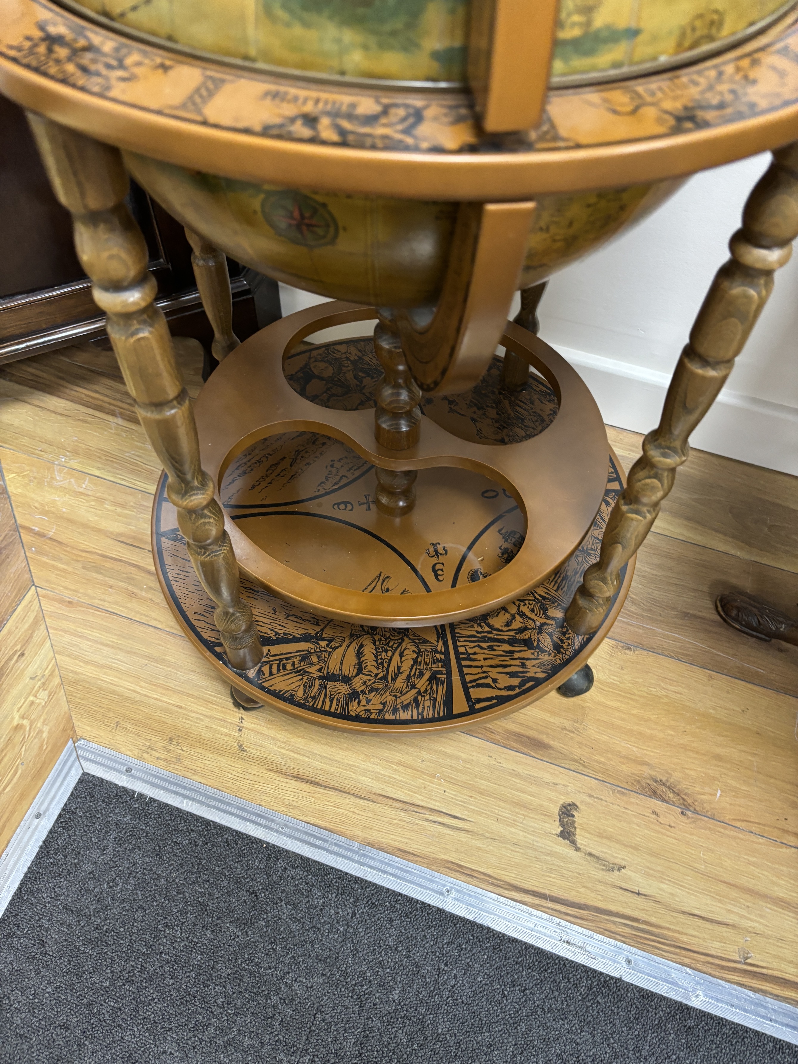 A reproduction globe drinks trolley, height 92cm